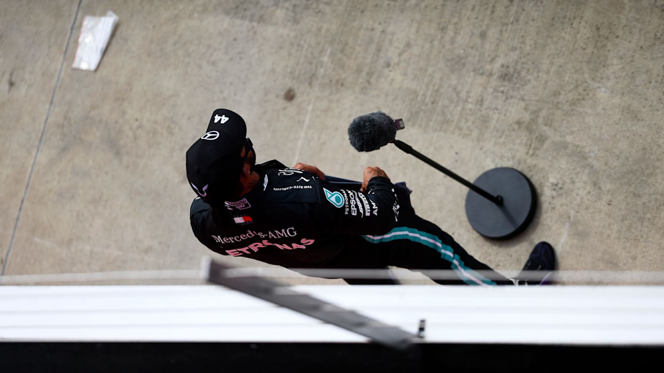NORTHAMPTON, ENGLAND - AUGUST 08: Second placed qualifier Lewis Hamilton of Great Britain and Mercedes GP talks to the media in parc ferme during qualifying for the F1 70th Anniversary Grand Prix at Silverstone on August 08, 2020 in Northampton, England. (Photo by Rudy Carezzevoli/Getty Images)