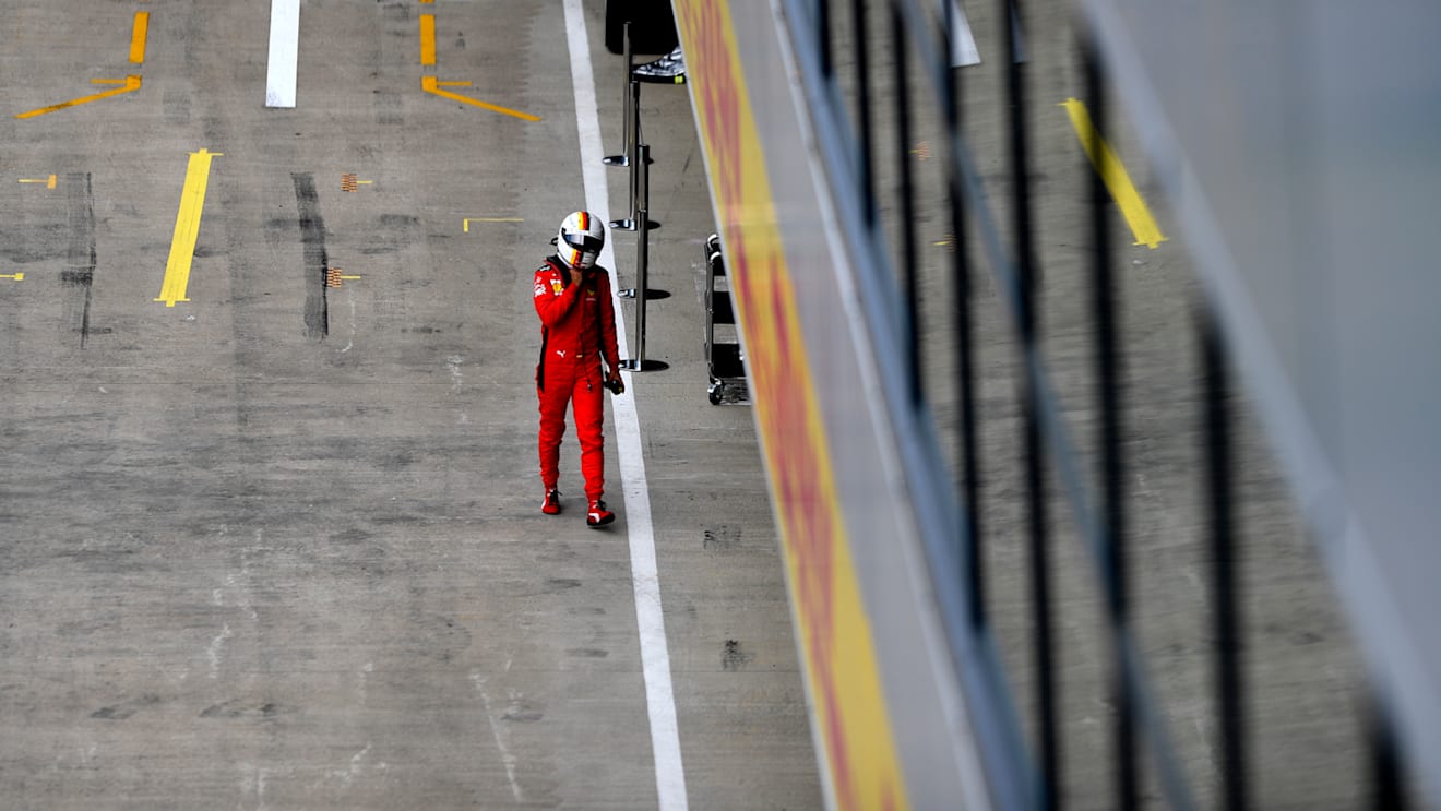 NORTHAMPTON, ENGLAND - AUGUST 08: Sebastian Vettel of Germany and Ferrari walks into the garage during qualifying for the F1 70th Anniversary Grand Prix at Silverstone on August 08, 2020 in Northampton, England. (Photo by Rudy Carezzevoli/Getty Images)