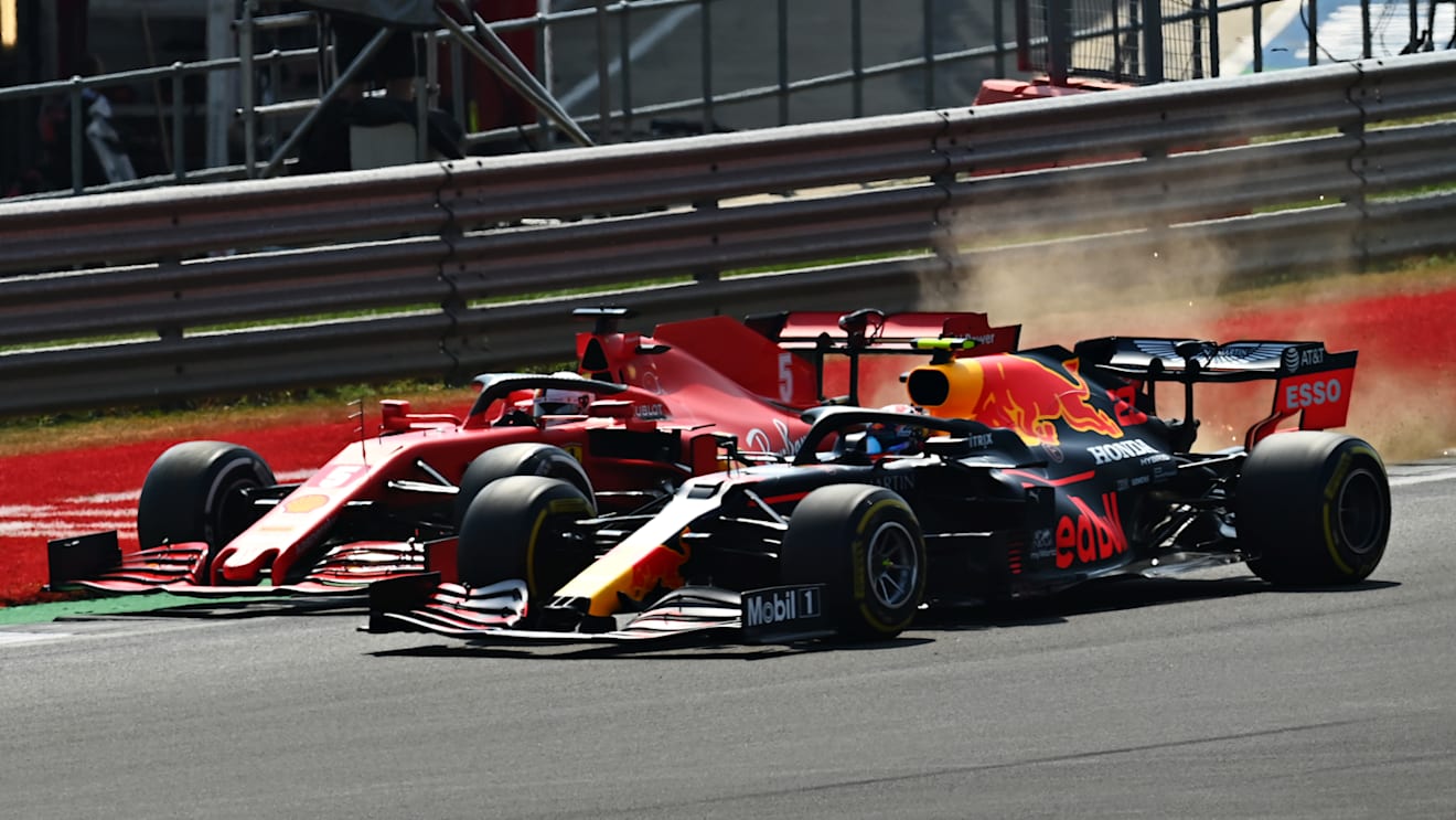 NORTHAMPTON, ENGLAND - AUGUST 09: Alexander Albon of Thailand driving the (23) Aston Martin Red Bull Racing RB16 and Sebastian Vettel of Germany driving the (5) Scuderia Ferrari SF1000 battle for position at  the start during the F1 70th Anniversary Grand Prix at Silverstone on August 09, 2020 in Northampton, England. (Photo by Clive Mason - Formula 1/Formula 1 via Getty Images)