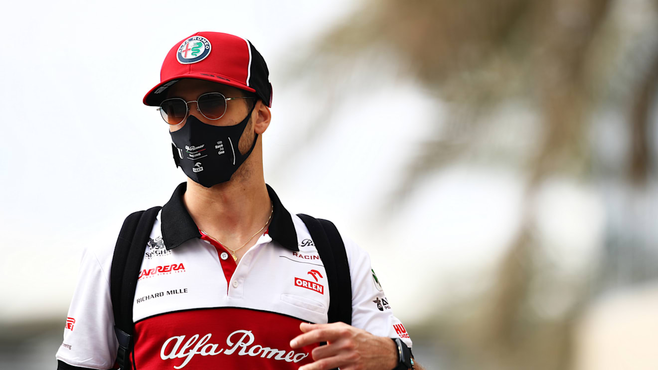 ABU DHABI, UNITED ARAB EMIRATES - DECEMBER 12: Antonio Giovinazzi of Italy and Alfa Romeo Racing walks in the Paddock before final practice ahead of the F1 Grand Prix of Abu Dhabi at Yas Marina Circuit on December 12, 2020 in Abu Dhabi, United Arab Emirates. (Photo by Mark Thompson/Getty Images)