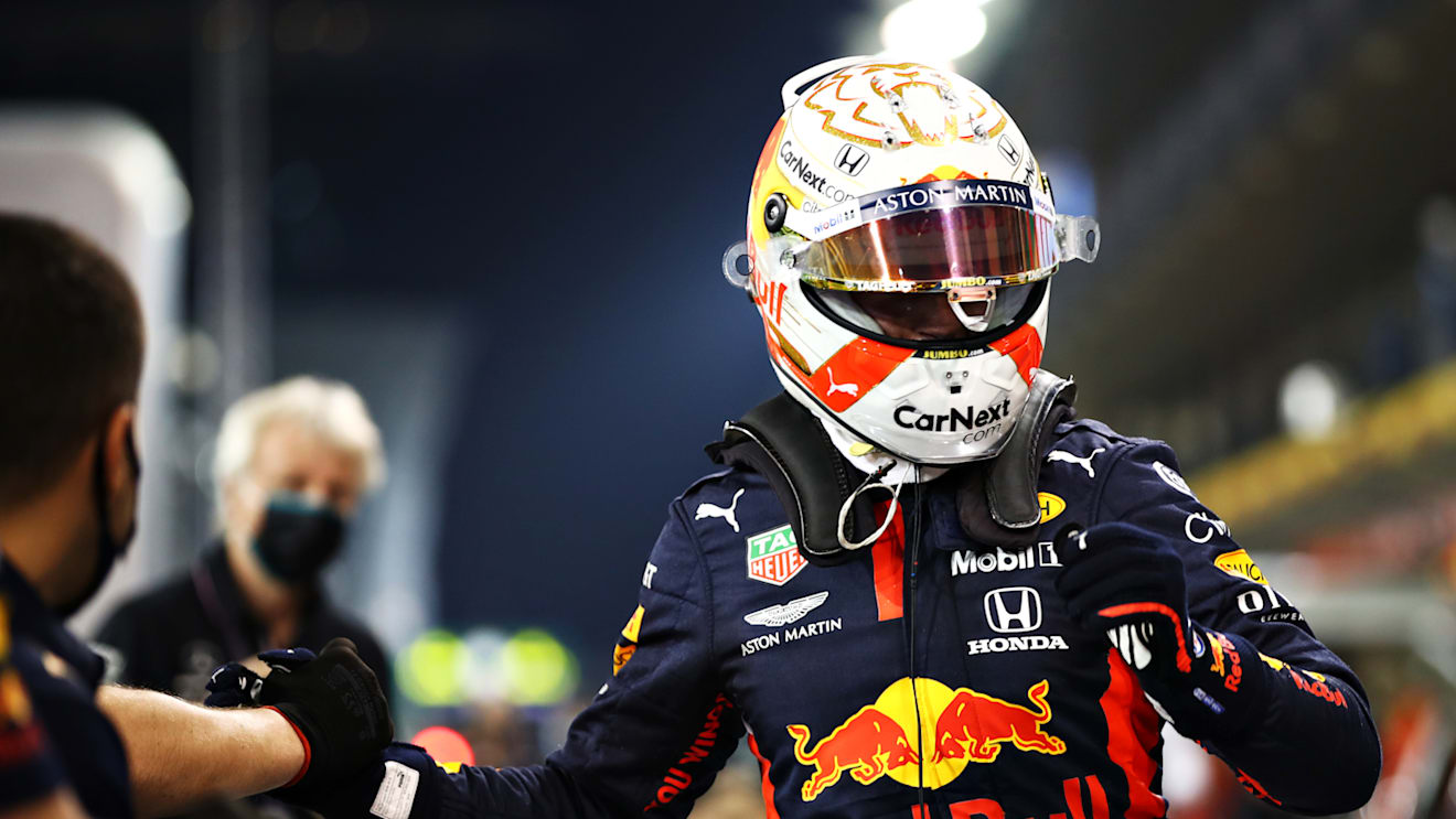 ABU DHABI, UNITED ARAB EMIRATES - DECEMBER 12: Pole position qualifier Max Verstappen of Netherlands and Red Bull Racing celebrates with his team in parc ferme during qualifying ahead of the F1 Grand Prix of Abu Dhabi at Yas Marina Circuit on December 12, 2020 in Abu Dhabi, United Arab Emirates. (Photo by Mark Thompson/Getty Images)