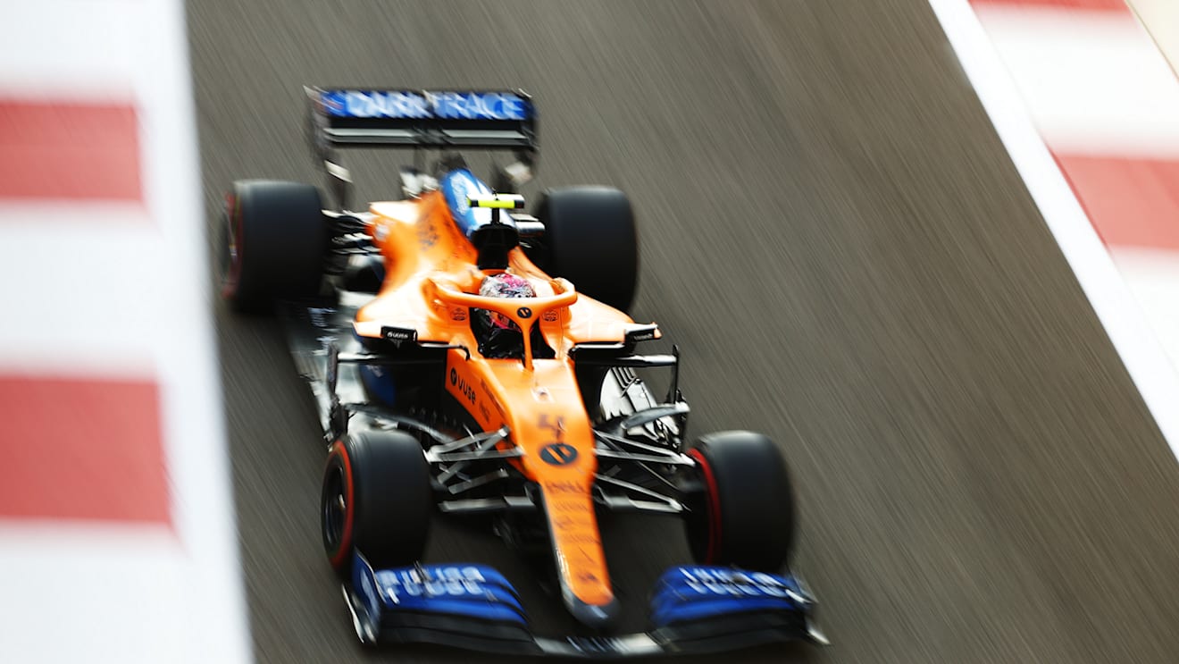 ABU DHABI, UNITED ARAB EMIRATES - DECEMBER 13: Lando Norris of Great Britain driving the (4) McLaren F1 Team MCL35 Renault on his way to the grid prior to the F1 Grand Prix of Abu Dhabi at Yas Marina Circuit on December 13, 2020 in Abu Dhabi, United Arab Emirates. (Photo by Bryn Lennon/Getty Images)