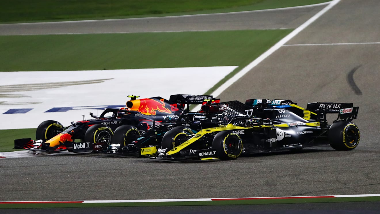 BAHRAIN, BAHRAIN - NOVEMBER 29: Alexander Albon of Thailand driving the (23) Aston Martin Red Bull Racing RB16, Valtteri Bottas of Finland driving the (77) Mercedes AMG Petronas F1 Team Mercedes W11 and Daniel Ricciardo of Australia driving the (3) Renault Sport Formula One Team RS20 battle for position at the start during the F1 Grand Prix of Bahrain at Bahrain International Circuit on November 29, 2020 in Bahrain, Bahrain. (Photo by Dan Istitene - Formula 1/Formula 1 via Getty Images)