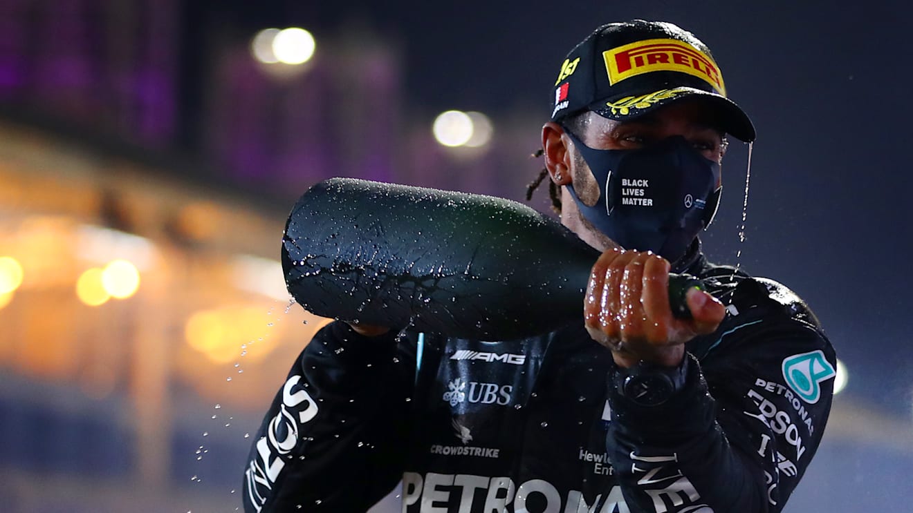 BAHRAIN, BAHRAIN - NOVEMBER 29: Race winner Lewis Hamilton of Great Britain and Mercedes GP celebrates on the podium during the F1 Grand Prix of Bahrain at Bahrain International Circuit on November 29, 2020 in Bahrain, Bahrain. (Photo by Dan Istitene - Formula 1/Formula 1 via Getty Images)