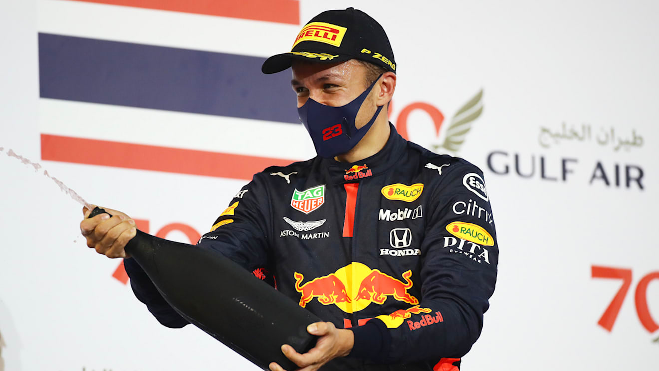 BAHRAIN, BAHRAIN - NOVEMBER 29: Third placed Alexander Albon of Thailand and Red Bull Racing celebrates on the podium during the F1 Grand Prix of Bahrain at Bahrain International Circuit on November 29, 2020 in Bahrain, Bahrain. (Photo by Bryn Lennon/Getty Images)