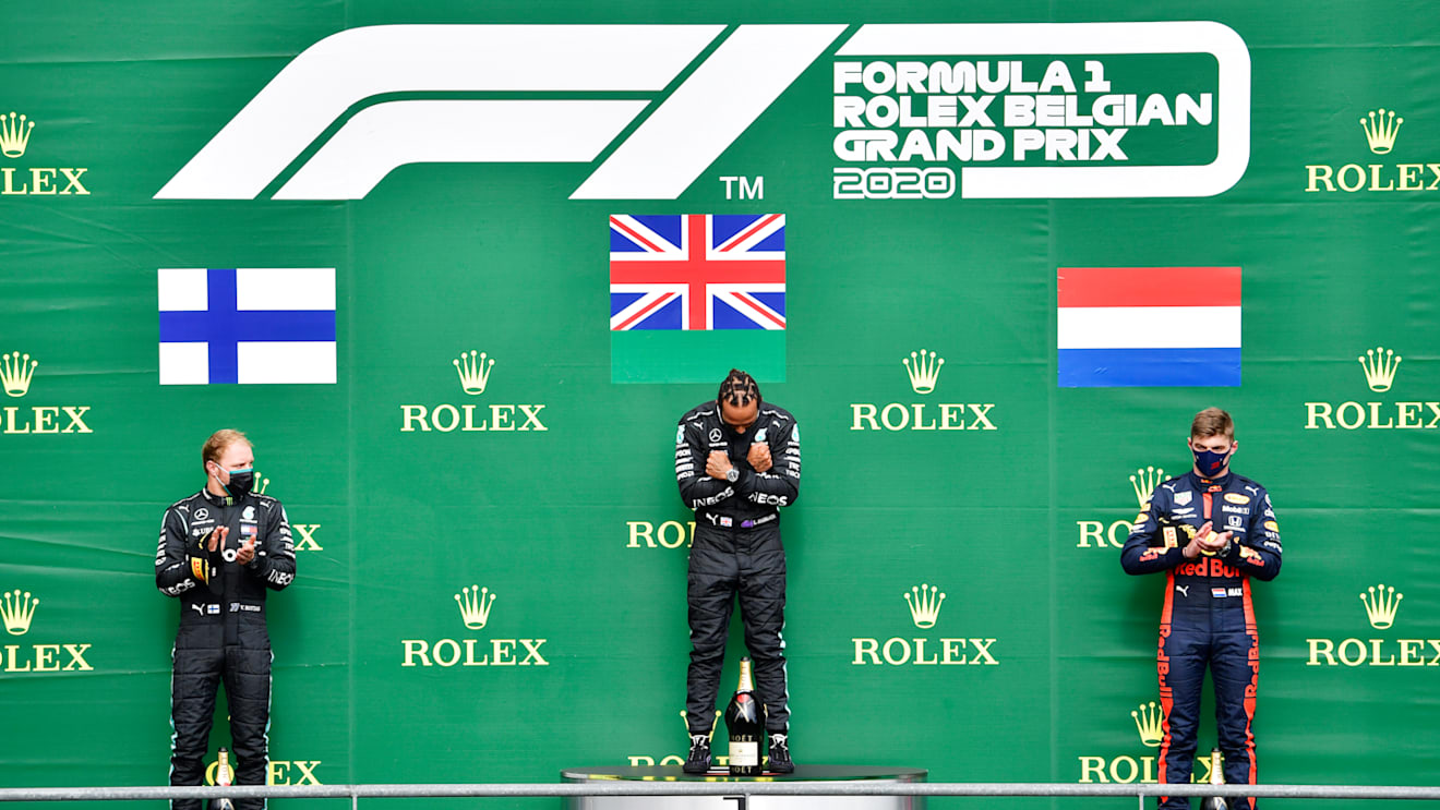 SPA, BELGIUM - AUGUST 30: Race winner Lewis Hamilton of Great Britain and Mercedes GP, second placed Valtteri Bottas of Finland and Mercedes GP and third placed Max Verstappen of Netherlands and Red Bull Racing stand on the podium during the F1 Grand Prix of Belgium at Circuit de Spa-Francorchamps on August 30, 2020 in Spa, Belgium. (Photo by John Thuys/Pool via Getty Images)