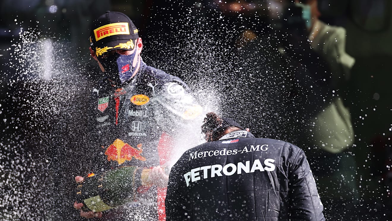 SPA, BELGIUM - AUGUST 30: Race winner Lewis Hamilton of Great Britain and Mercedes GP and Third placed Max Verstappen of Netherlands and Red Bull Racing celebrate on the podium during the F1 Grand Prix of Belgium at Circuit de Spa-Francorchamps on August 30, 2020 in Spa, Belgium. (Photo by Lars Baron/Getty Images)