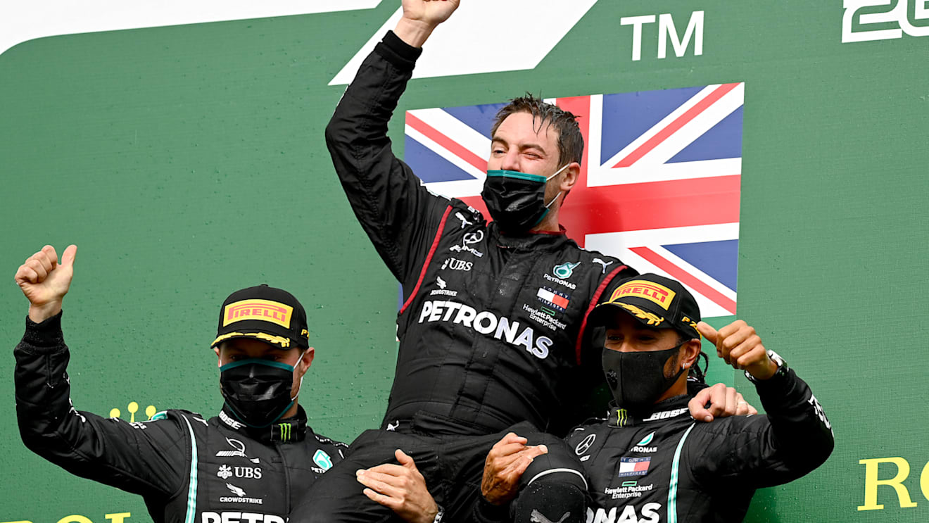 SPA, BELGIUM - AUGUST 30: Race winner Lewis Hamilton of Great Britain and Mercedes GP, second placed Valtteri Bottas of Finland and Mercedes GP and front end mechanic at Mercedes GP Sam Bradley celebrate on the podium during the F1 Grand Prix of Belgium at Circuit de Spa-Francorchamps on August 30, 2020 in Spa, Belgium. (Photo by Clive Mason - Formula 1/Formula 1 via Getty Images)