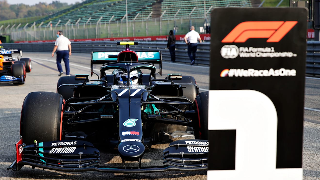 IMOLA, ITALY - OCTOBER 31: Pole position qualifier Valtteri Bottas of Finland driving the (77) Mercedes AMG Petronas F1 Team Mercedes W11 arrives in parc ferme during qualifying ahead of the F1 Grand Prix of Emilia Romagna at Autodromo Enzo e Dino Ferrari on October 31, 2020 in Imola, Italy. (Photo by Luca Bruno - Pool/Getty Images)