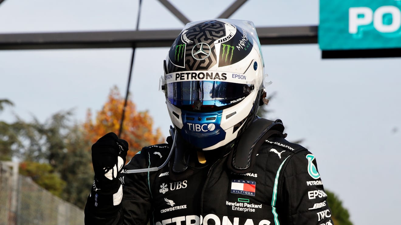 IMOLA, ITALY - OCTOBER 31: Pole position qualifier Valtteri Bottas of Finland and Mercedes GP climbs from his car in parc ferme during qualifying ahead of the F1 Grand Prix of Emilia Romagna at Autodromo Enzo e Dino Ferrari on October 31, 2020 in Imola, Italy. (Photo by Luca Bruno - Pool/Getty Images)