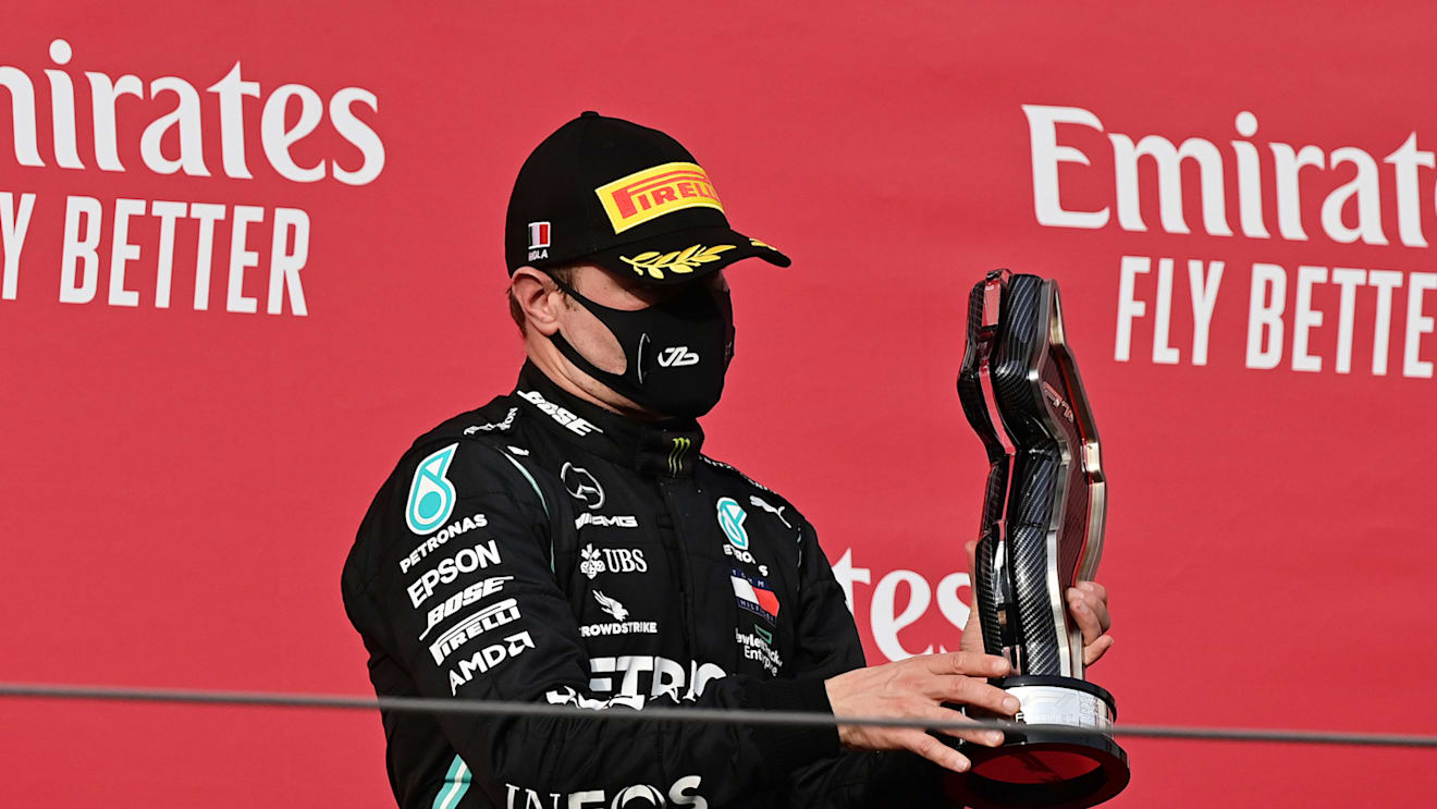 IMOLA, ITALY - NOVEMBER 01: Second place Valtteri Bottas of Finland and Mercedes GP celebrates on the podium during the F1 Grand Prix of Emilia Romagna at Autodromo Enzo e Dino Ferrari on November 01, 2020 in Imola, Italy. (Photo by Miguel Medina - Pool/Getty Images)