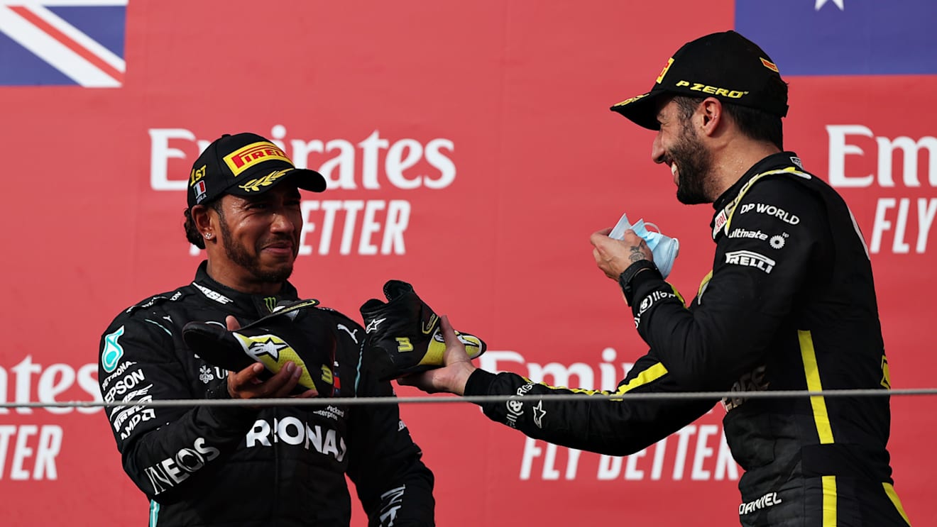 IMOLA, ITALY - NOVEMBER 01: Race winner Lewis Hamilton of Great Britain and Mercedes GP and third placed Daniel Ricciardo of Australia and Renault Sport F1 celebrate on the podium during the F1 Grand Prix of Emilia Romagna at Autodromo Enzo e Dino Ferrari on November 01, 2020 in Imola, Italy. (Photo by Lars Baron - Formula 1/Formula 1 via Getty Images)