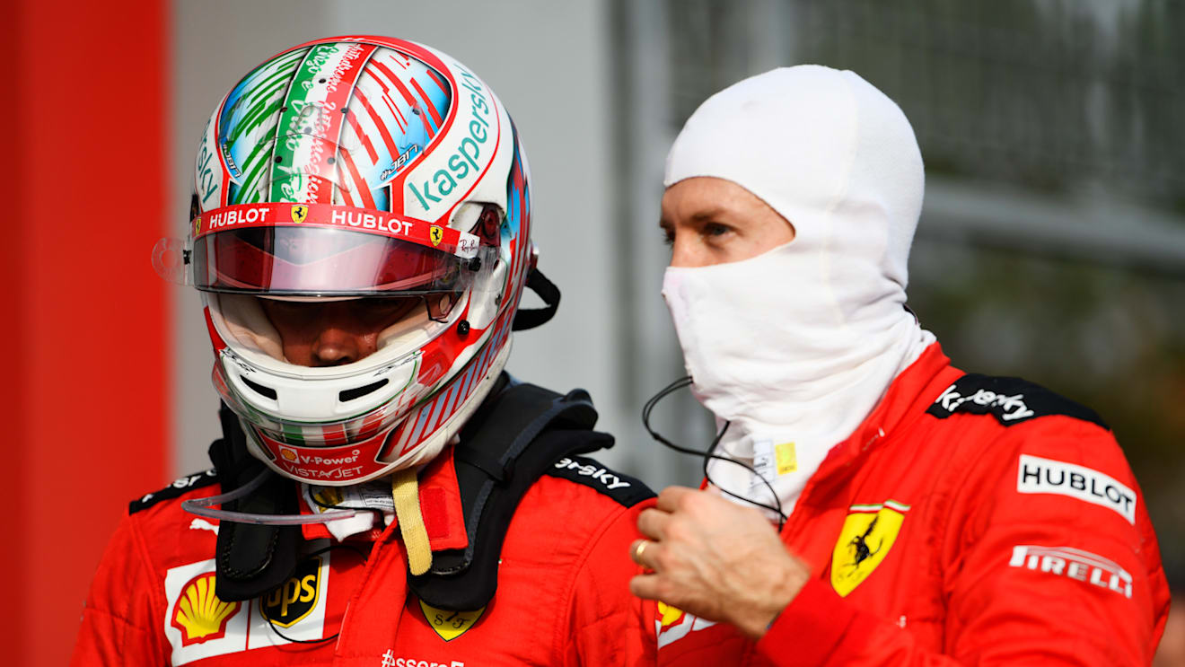 IMOLA, ITALY - NOVEMBER 01: Charles Leclerc of Monaco and Ferrari speaks with teammate Sebastian Vettel of Germany and Ferrari in parc ferme during the F1 Grand Prix of Emilia Romagna at Autodromo Enzo e Dino Ferrari on November 01, 2020 in Imola, Italy. (Photo by Rudy Carezzevoli/Getty Images)