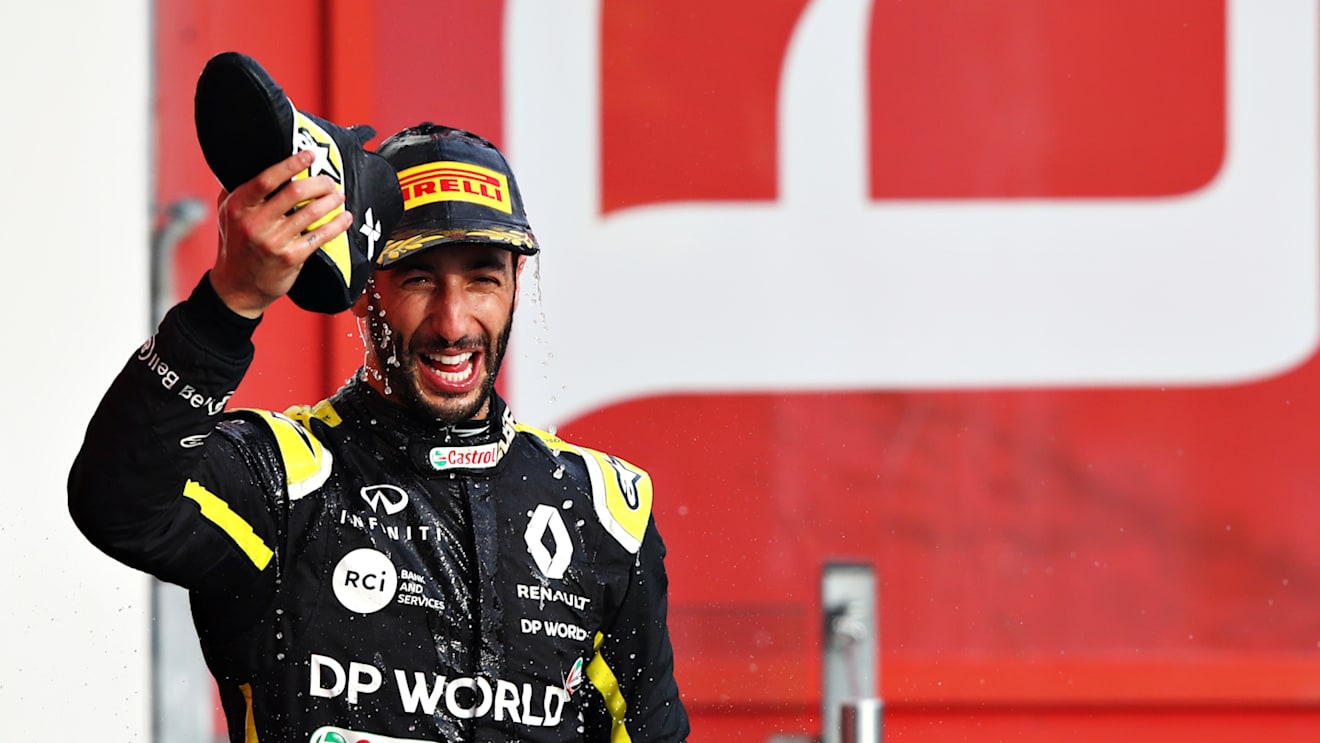 IMOLA, ITALY - NOVEMBER 01: Third placed Daniel Ricciardo of Australia and Renault Sport F1 celebrates on the podium with a shoey during the F1 Grand Prix of Emilia Romagna at Autodromo Enzo e Dino Ferrari on November 01, 2020 in Imola, Italy. (Photo by Mark Thompson/Getty Images)
