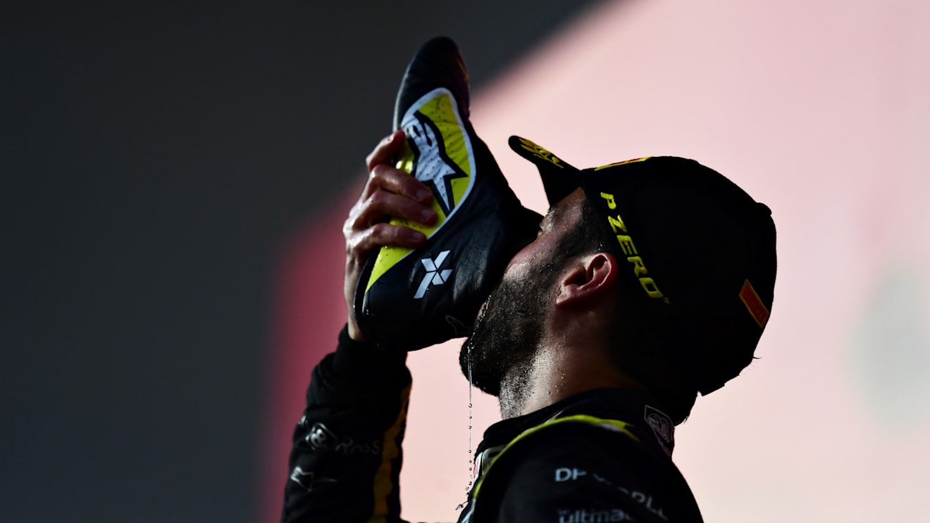 IMOLA, ITALY - NOVEMBER 01: Third placed Daniel Ricciardo of Australia and Renault Sport F1 celebrates on the podium with a shoey during the F1 Grand Prix of Emilia Romagna at Autodromo Enzo e Dino Ferrari on November 01, 2020 in Imola, Italy. (Photo by Mario Renzi - Formula 1/Formula 1 via Getty Images)