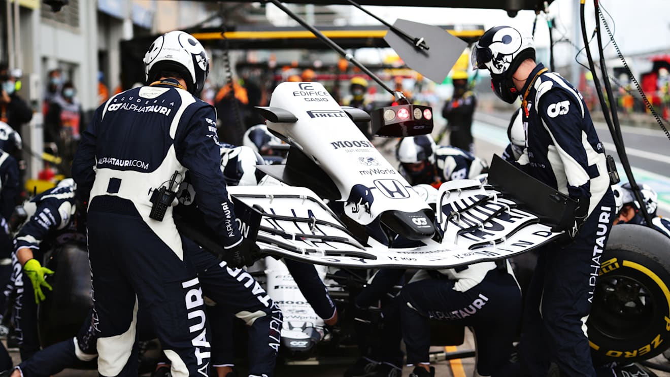 NUERBURG, GERMANY - OCTOBER 11: Daniil Kvyat of Russia driving the (26) Scuderia AlphaTauri AT01 Honda makes a pitstop for a new front wing during the F1 Eifel Grand Prix at Nuerburgring on October 11, 2020 in Nuerburg, Germany. (Photo by Peter Fox/Getty Images)