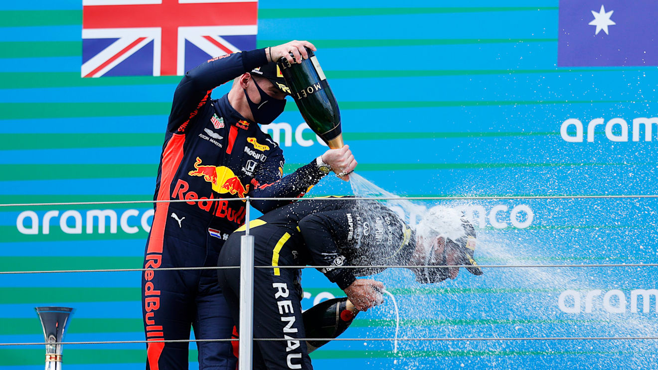 NUERBURG, GERMANY - OCTOBER 11: Race winner Lewis Hamilton of Great Britain and Mercedes GP and second placed Max Verstappen of Netherlands and Red Bull Racing celebrate on the podium during the F1 Eifel Grand Prix at Nuerburgring on October 11, 2020 in Nuerburg, Germany. (Photo by Ronald Wittek - Pool/Getty Images)