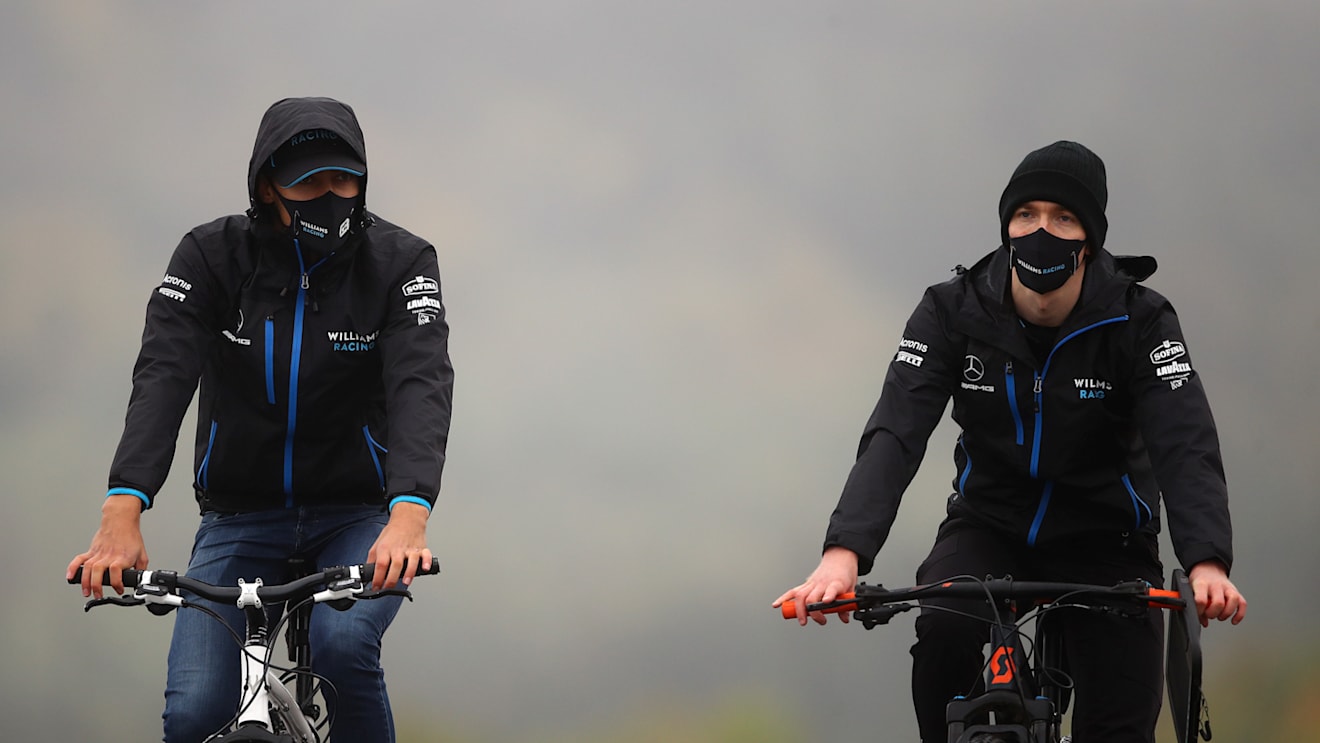 NUERBURG, GERMANY - OCTOBER 08: George Russell of Great Britain and Williams (left) cycles the track during previews ahead of the F1 Eifel Grand Prix at Nuerburgring on October 08, 2020 in Nuerburg, Germany. (Photo by Bryn Lennon/Getty Images)