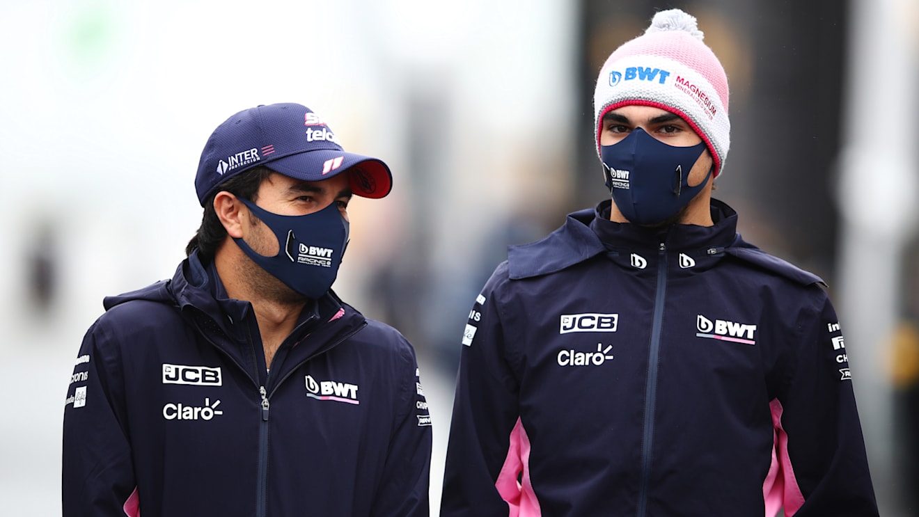 NUERBURG, GERMANY - OCTOBER 08: Sergio Perez of Mexico and Racing Point and Nicholas Latifi of Canada and Williams walk in the Paddock during previews ahead of the F1 Eifel Grand Prix at Nuerburgring on October 08, 2020 in Nuerburg, Germany. (Photo by Mark Thompson/Getty Images)