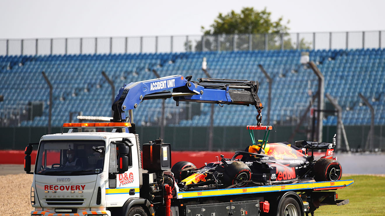 NORTHAMPTON, ENGLAND - JULY 31: The car of Alexander Albon of Thailand and Red Bull Racing is transported back to the pits on a recovery truck after crashing into a track barrier during practice for the F1 Grand Prix of Great Britain at Silverstone on July 31, 2020 in Northampton, England. (Photo by Bryn Lennon/Getty Images)