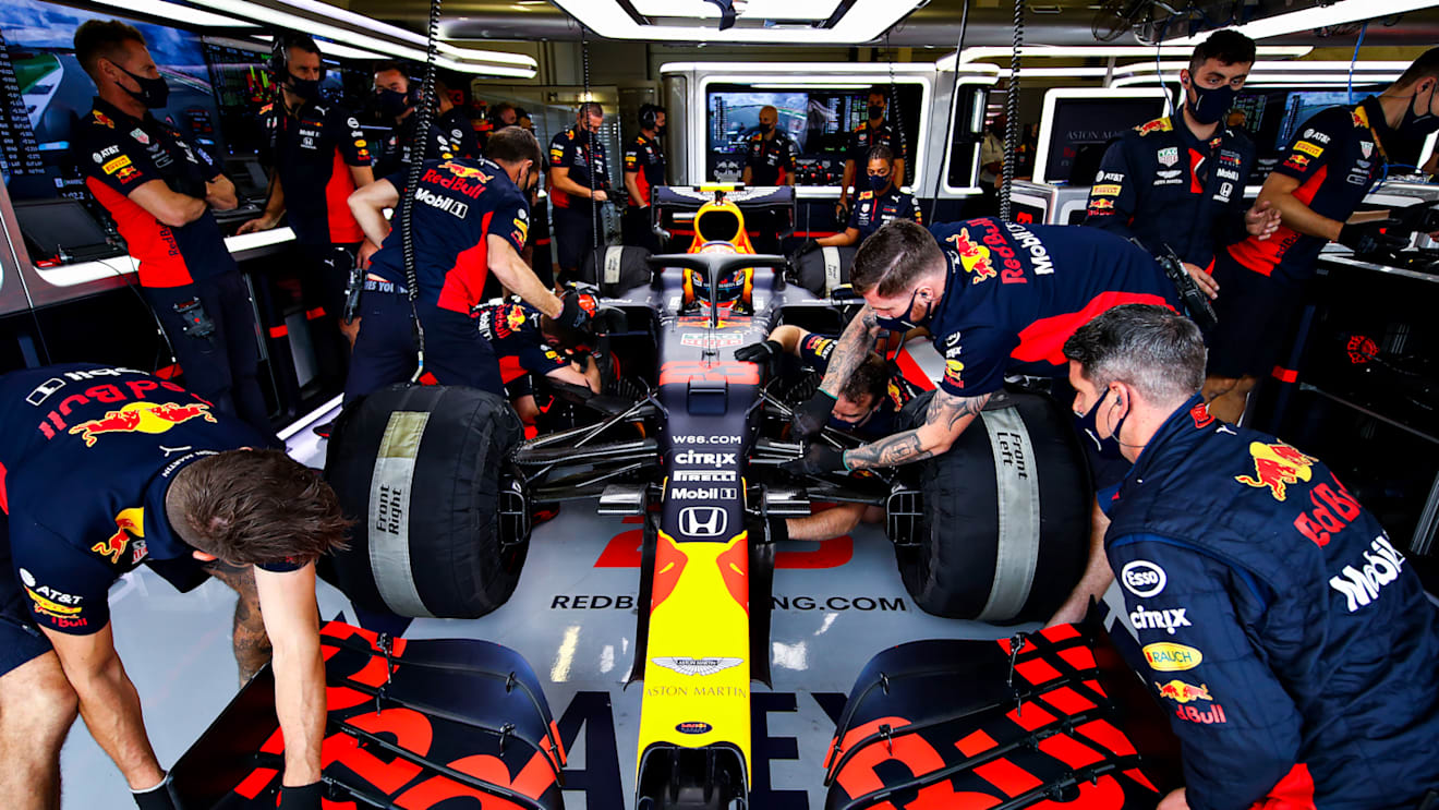 NORTHAMPTON, ENGLAND - AUGUST 01: The Red Bull Racing team work on the car of Alexander Albon of Thailand and Red Bull Racing in the garage during final practice for the F1 Grand Prix of Great Britain at Silverstone on August 01, 2020 in Northampton, England. (Photo by Mark Thompson/Getty Images)