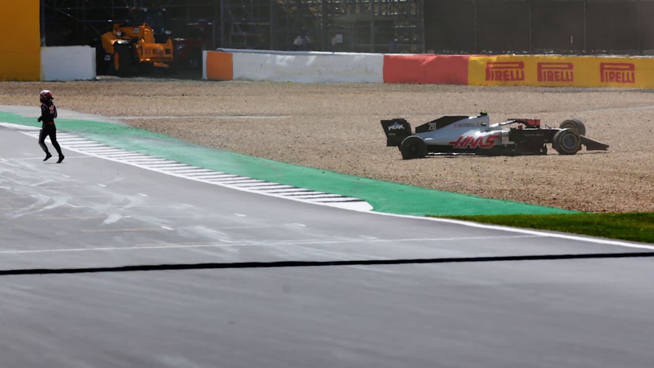 NORTHAMPTON, ENGLAND - AUGUST 02:Kevin Magnussen of Denmark and Haas F1 runs from his car after spinning off during the F1 Grand Prix of Great Britain at Silverstone on August 02, 2020 in Northampton, England. (Photo by Peter Fox/Getty Images)