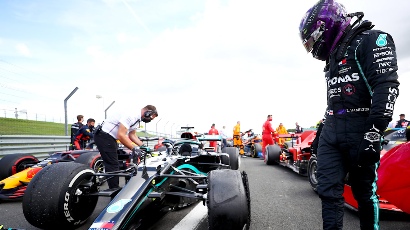 NORTHAMPTON, ENGLAND - AUGUST 02: Lewis Hamilton of Great Britain and Mercedes GP inspects his punctured tyre in parc ferme after the Formula One Grand Prix of Hungary at Silverstone on August 02, 2020 in Northampton, England. (Photo by Dan Istitene - Formula 1/Formula 1 via Getty Images)