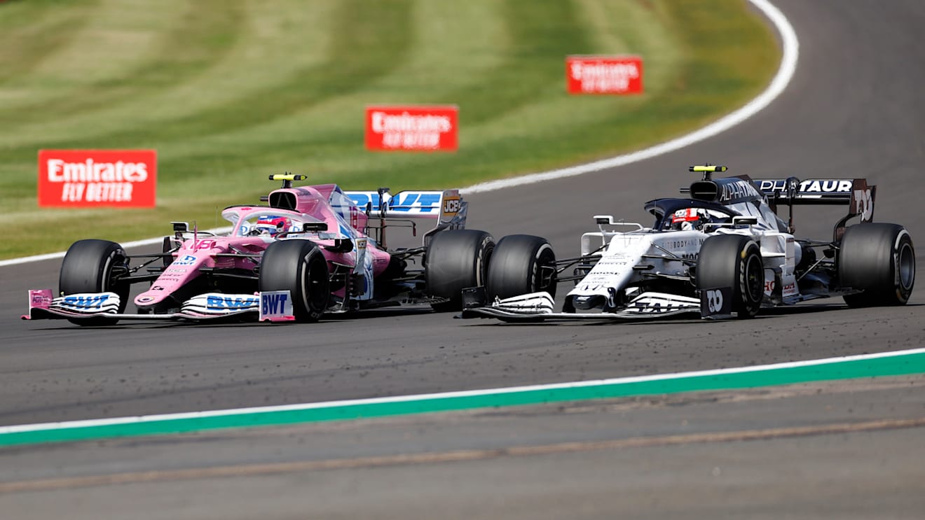 NORTHAMPTON, ENGLAND - AUGUST 02: Lance Stroll of Canada driving the (18) Racing Point RP20 Mercedes battles for position with Pierre Gasly of France driving the (10) Scuderia AlphaTauri AT01 Honda during the F1 Grand Prix of Great Britain at Silverstone on August 02, 2020 in Northampton, England. (Photo by Andrew Boyers/Pool via Getty Images)