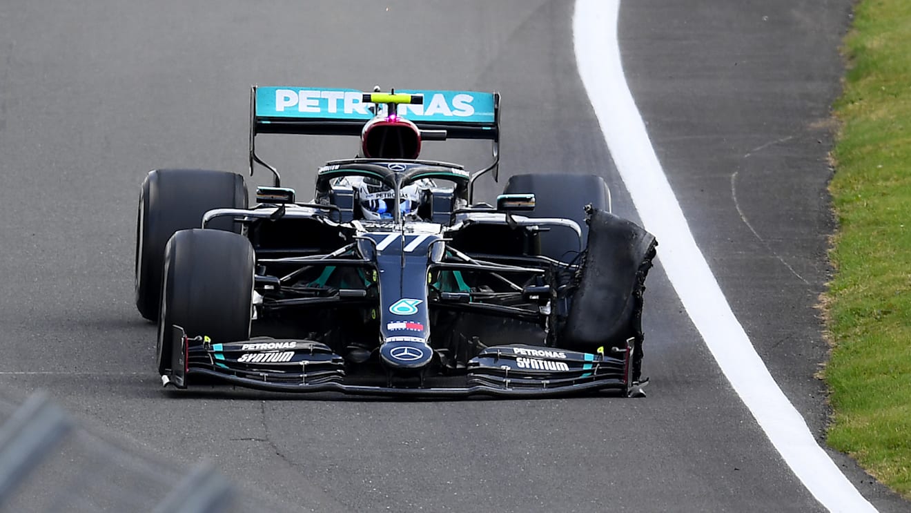 NORTHAMPTON, ENGLAND - AUGUST 02: Valtteri Bottas of Finland driving the (77) Mercedes AMG Petronas F1 Team Mercedes W11 with a punctured front left tyre during the F1 Grand Prix of Great Britain at Silverstone on August 02, 2020 in Northampton, England. (Photo by Clive Mason - Formula 1/Formula 1 via Getty Images)