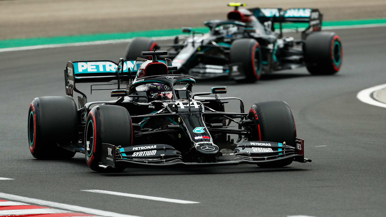 BUDAPEST, HUNGARY - JULY 18: Lewis Hamilton of Great Britain driving the (44) Mercedes AMG Petronas F1 Team Mercedes W11 leads teammate Valtteri Bottas of Finland driving the (77) Mercedes AMG Petronas F1 Team Mercedes W11 during qualifying for the F1 Grand Prix of Hungary at Hungaroring on July 18, 2020 in Budapest, Hungary. (Photo by Darko Bandic/Pool via Getty Images)