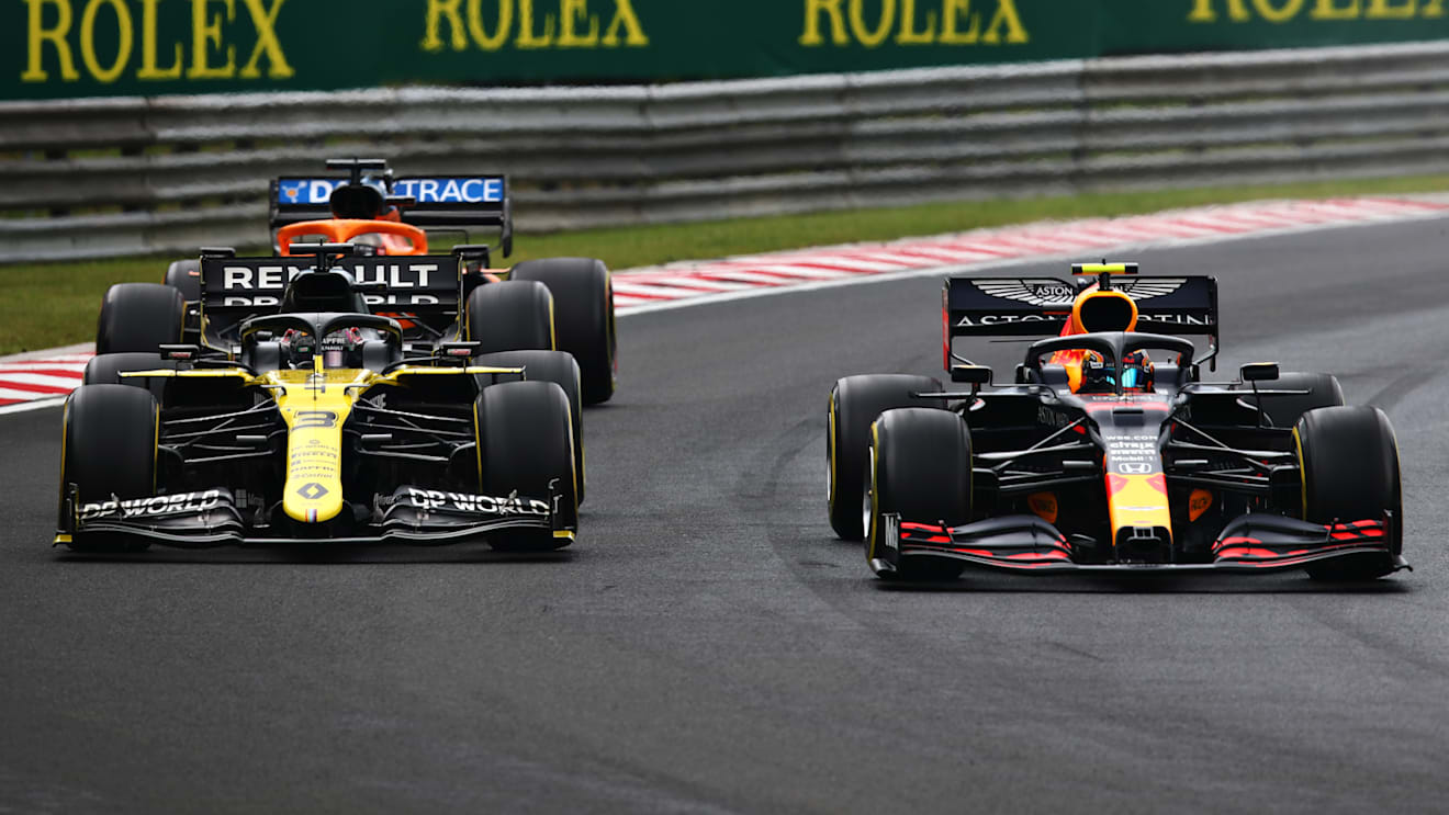 BUDAPEST, HUNGARY - JULY 19: Alexander Albon of Thailand driving the (23) Aston Martin Red Bull Racing RB16 leads Daniel Ricciardo of Australia driving the (3) Renault Sport Formula One Team RS20 during the Formula One Grand Prix of Hungary at Hungaroring on July 19, 2020 in Budapest, Hungary. (Photo by Joe Portlock - Formula 1/Formula 1 via Getty Images)
