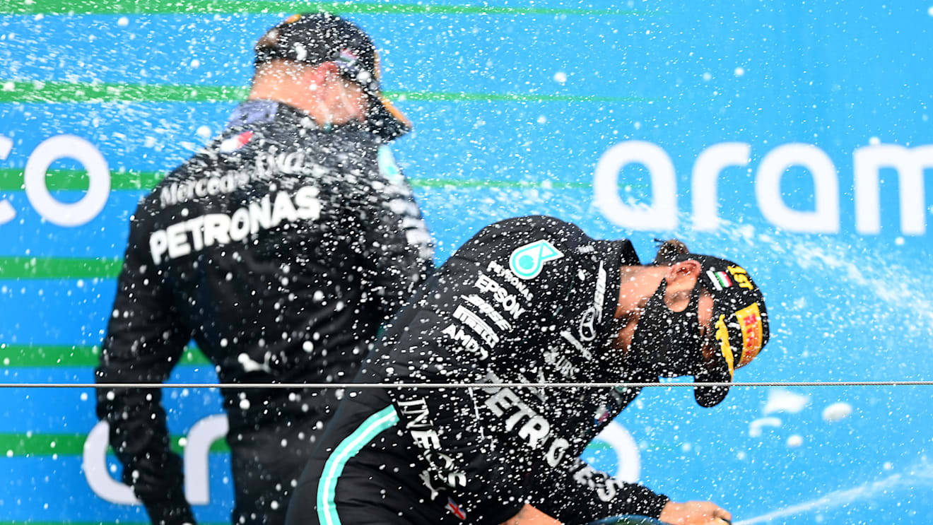 BUDAPEST, HUNGARY - JULY 19: Race winner Lewis Hamilton of Great Britain and Mercedes GP celebrates on the podium after the Formula One Grand Prix of Hungary at Hungaroring on July 19, 2020 in Budapest, Hungary. (Photo by Clive Mason - Formula 1/Formula 1 via Getty Images)