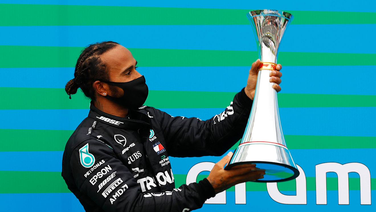 BUDAPEST, HUNGARY - JULY 19: Race winner Lewis Hamilton of Great Britain and Mercedes GP celebrates on the podium after the Formula One Grand Prix of Hungary at Hungaroring on July 19, 2020 in Budapest, Hungary. (Photo by Leonhard Foeger/Pool via Getty Images)