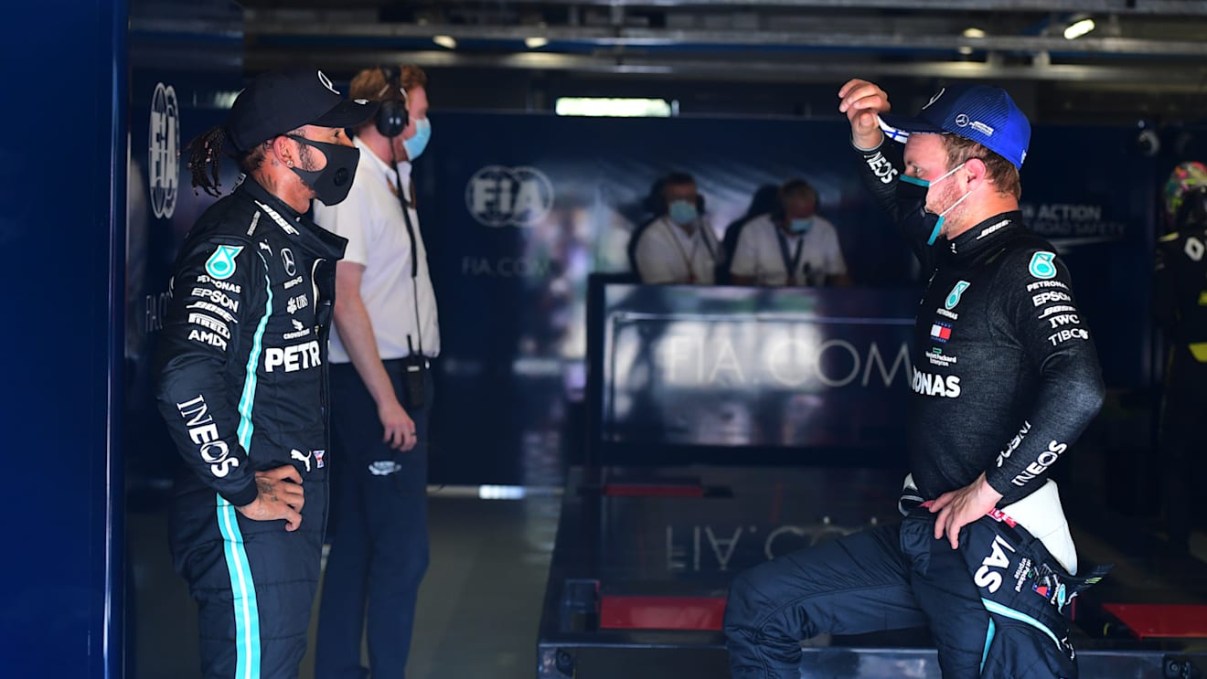 MONZA, ITALY - SEPTEMBER 05: Pole position qualifier Lewis Hamilton of Great Britain and Mercedes GP talks to second placed qualifier Valtteri Bottas of Finland and Mercedes GP in the garage during qualifying for the F1 Grand Prix of Italy at Autodromo di Monza on September 05, 2020 in Monza, Italy. (Photo by Jenifer Lorenzini - Pool/Getty Images)