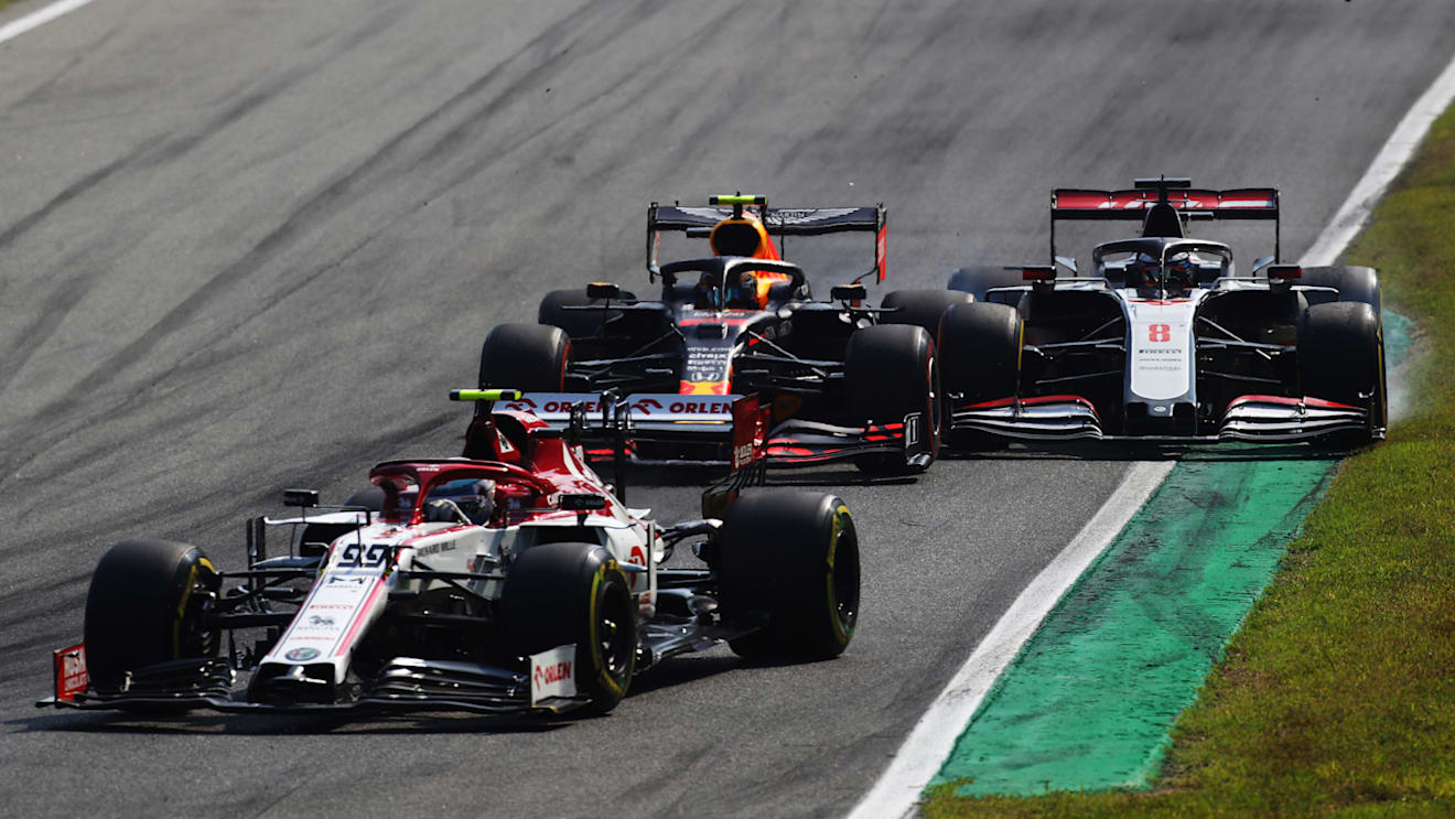 MONZA, ITALY - SEPTEMBER 06: Alexander Albon of Thailand driving the (23) Aston Martin Red Bull Racing RB16 battles for position with Romain Grosjean of France driving the (8) Haas F1 Team VF-20 Ferrari during the F1 Grand Prix of Italy at Autodromo di Monza on September 06, 2020 in Monza, Italy. (Photo by Mark Thompson/Getty Images)