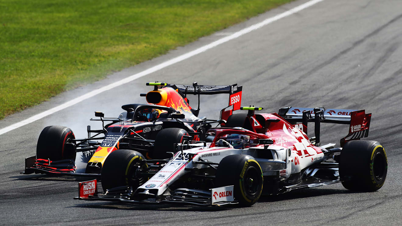 MONZA, ITALY - SEPTEMBER 06: Alexander Albon of Thailand driving the (23) Aston Martin Red Bull Racing RB16 and Antonio Giovinazzi of Italy driving the (99) Alfa Romeo Racing C39 Ferrari battle for position during the F1 Grand Prix of Italy at Autodromo di Monza on September 06, 2020 in Monza, Italy. (Photo by Mark Thompson/Getty Images)