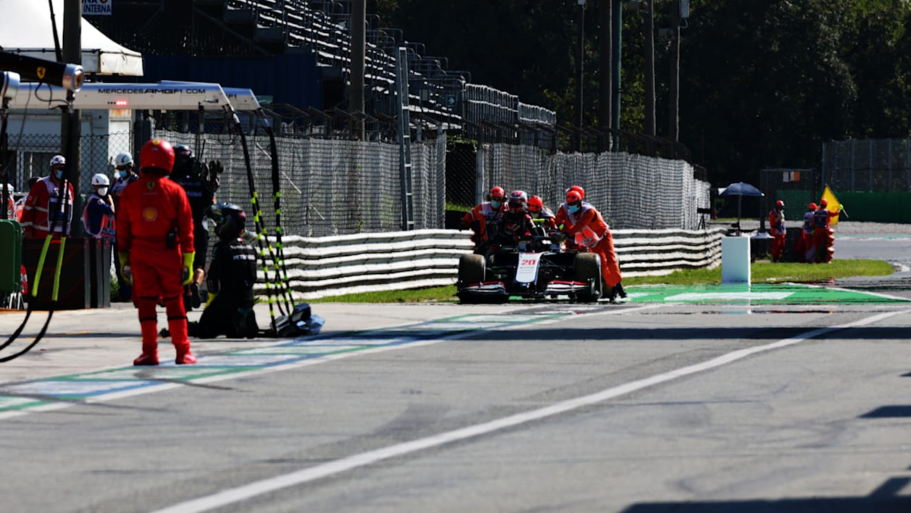 MONZA, ITALY - SEPTEMBER 06: The car of Kevin Magnussen of Denmark and Haas F1 is pushed back into the pitlane during the F1 Grand Prix of Italy at Autodromo di Monza on September 06, 2020 in Monza, Italy. (Photo by Peter Fox/Getty Images)