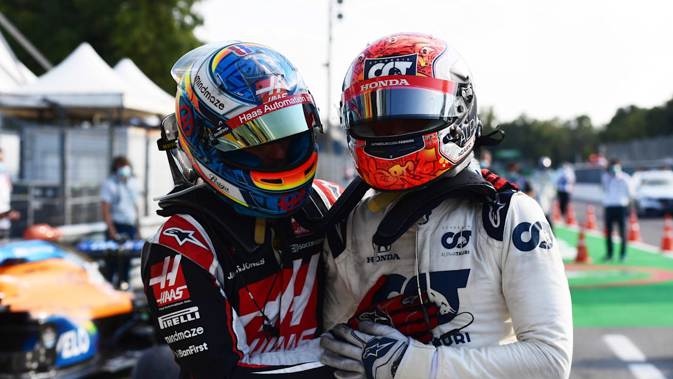 MONZA, ITALY - SEPTEMBER 06: Race winner Pierre Gasly of France and Scuderia AlphaTauri celebrates with Romain Grosjean of France and Haas F1 in parc ferme during the F1 Grand Prix of Italy at Autodromo di Monza on September 06, 2020 in Monza, Italy. (Photo by Miguel Medina - Pool/Getty Images)
