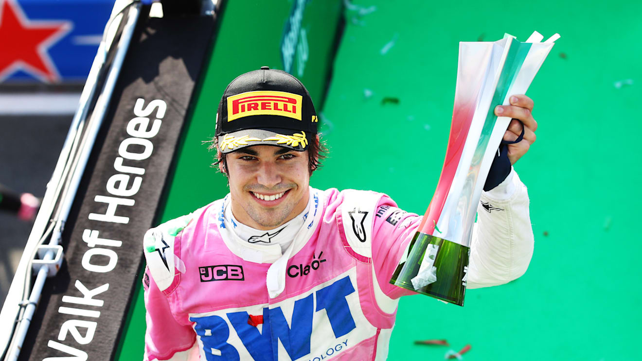 MONZA, ITALY - SEPTEMBER 06: Third placed Lance Stroll of Canada and Racing Point celebrates on the podium during the F1 Grand Prix of Italy at Autodromo di Monza on September 06, 2020 in Monza, Italy. (Photo by Mark Thompson/Getty Images)