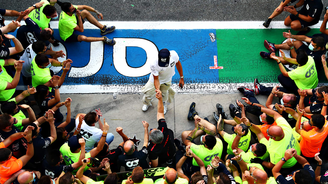 MONZA, ITALY - SEPTEMBER 06: Race winner Pierre Gasly of France and Scuderia AlphaTauri and teammate Daniil Kvyat of Russia and Scuderia AlphaTauri celebrate with team members during the F1 Grand Prix of Italy at Autodromo di Monza on September 06, 2020 in Monza, Italy. (Photo by Dan Istitene - Formula 1/Formula 1 via Getty Images)