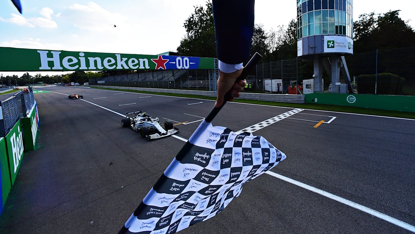 MONZA, ITALY - SEPTEMBER 06: Race winner Pierre Gasly of France driving the (10) Scuderia AlphaTauri AT01 Honda takes the chequered flag as he crosses the line during the F1 Grand Prix of Italy at Autodromo di Monza on September 06, 2020 in Monza, Italy. (Photo by Mario Renzi - Formula 1/Formula 1 via Getty Images)