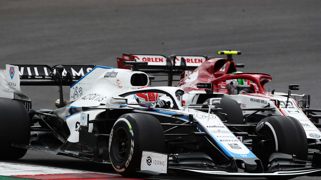 PORTIMAO, PORTUGAL - OCTOBER 25: George Russell of Great Britain driving the (63) Williams Racing FW43 Mercedes and Antonio Giovinazzi of Italy driving the (99) Alfa Romeo Racing C39 Ferrari battle for position on track during the F1 Grand Prix of Portugal at Autodromo Internacional do Algarve on October 25, 2020 in Portimao, Portugal. (Photo by Joe Portlock/Getty Images)