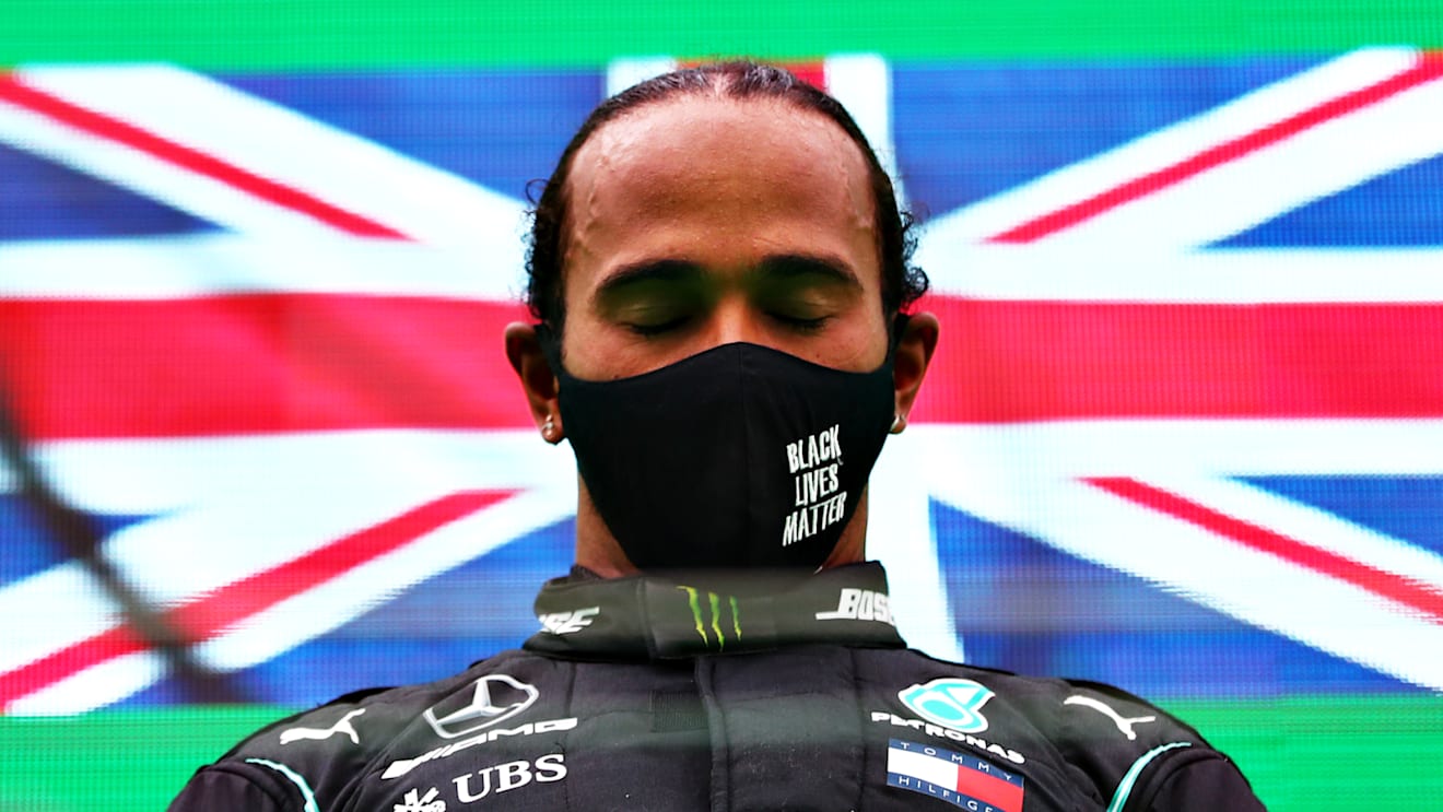 PORTIMAO, PORTUGAL - OCTOBER 25: Race winner Lewis Hamilton of Great Britain and Mercedes GP celebrates his record breaking 92nd race win on the podium during the F1 Grand Prix of Portugal at Autodromo Internacional do Algarve on October 25, 2020 in Portimao, Portugal. (Photo by Dan Istitene - Formula 1/Formula 1 via Getty Images)