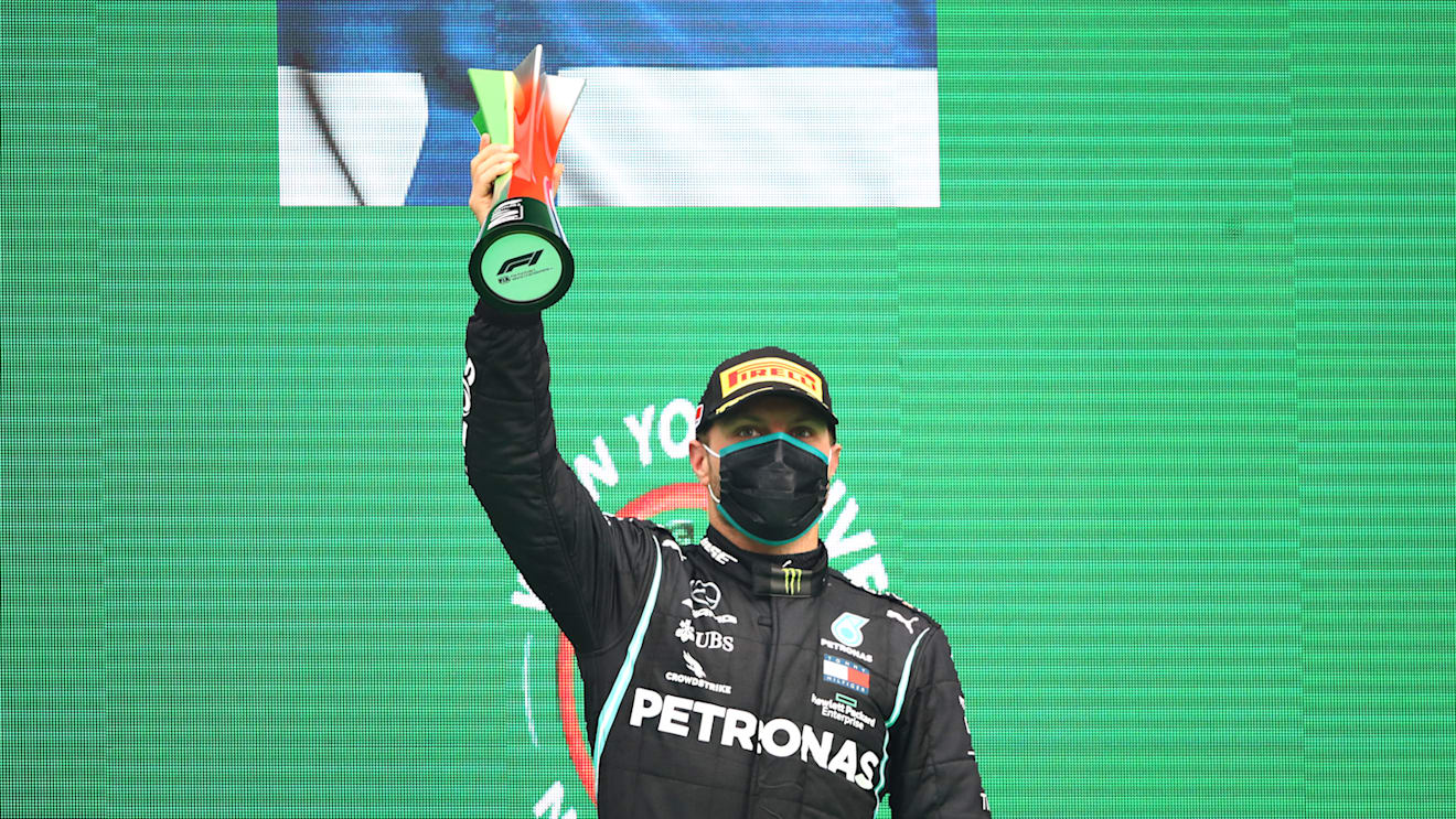 PORTIMAO, PORTUGAL - OCTOBER 25: Second placed Valtteri Bottas of Finland and Mercedes GP celebrates on the podium during the F1 Grand Prix of Portugal at Autodromo Internacional do Algarve on October 25, 2020 in Portimao, Portugal. (Photo by Bryn Lennon - Formula 1/Formula 1 via Getty Images)