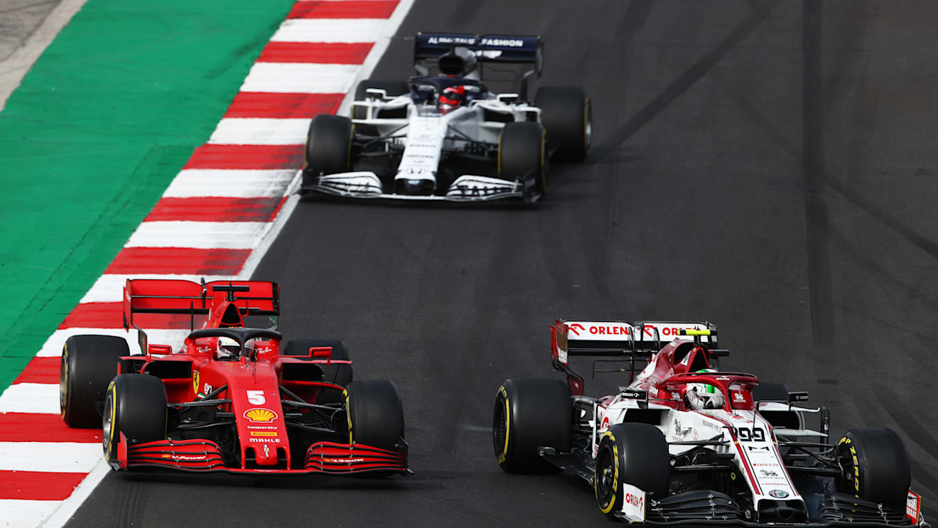PORTIMAO, PORTUGAL - OCTOBER 25: Sebastian Vettel of Germany driving the (5) Scuderia Ferrari SF1000 and Antonio Giovinazzi of Italy driving the (99) Alfa Romeo Racing C39 Ferrari battle for position on track during the F1 Grand Prix of Portugal at Autodromo Internacional do Algarve on October 25, 2020 in Portimao, Portugal. (Photo by Joe Portlock/Getty Images)