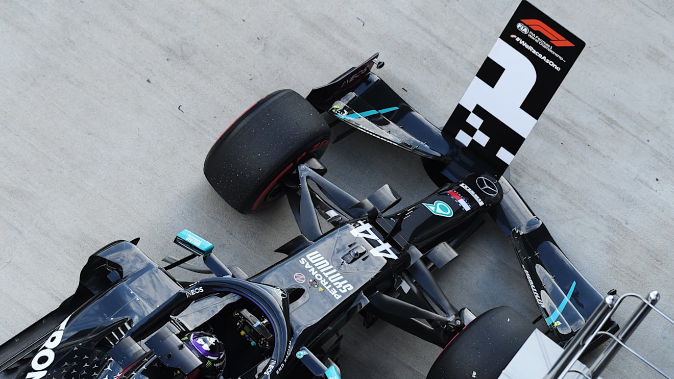 SOCHI, RUSSIA - SEPTEMBER 26: Pole position qualifier Lewis Hamilton of Great Britain and Mercedes GP arrives in parc ferme during qualifying ahead of the F1 Grand Prix of Russia at Sochi Autodrom on September 26, 2020 in Sochi, Russia. (Photo by Kirill Kudryavtsev - Pool/Getty Images)