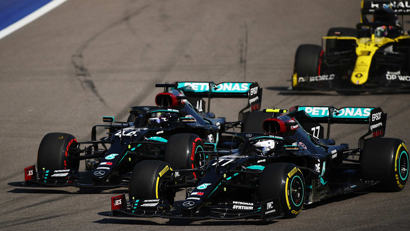 SOCHI, RUSSIA - SEPTEMBER 27: Valtteri Bottas of Finland driving the (77) Mercedes AMG Petronas F1 Team Mercedes W11 and Lewis Hamilton of Great Britain driving the (44) Mercedes AMG Petronas F1 Team Mercedes W11 battle for position during the F1 Grand Prix of Russia at Sochi Autodrom on September 27, 2020 in Sochi, Russia. (Photo by Bryn Lennon/Getty Images)