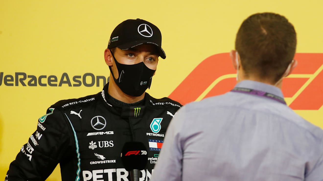 BAHRAIN, BAHRAIN - DECEMBER 05: Second placed qualifier George Russell of Great Britain and Mercedes GP speaks with Sky Sports F1 Presenter Paul di Resta in parc ferme during qualifying ahead of the F1 Grand Prix of Sakhir at Bahrain International Circuit on December 05, 2020 in Bahrain, Bahrain. (Photo by Hamad I Mohammed - Pool/Getty Images)