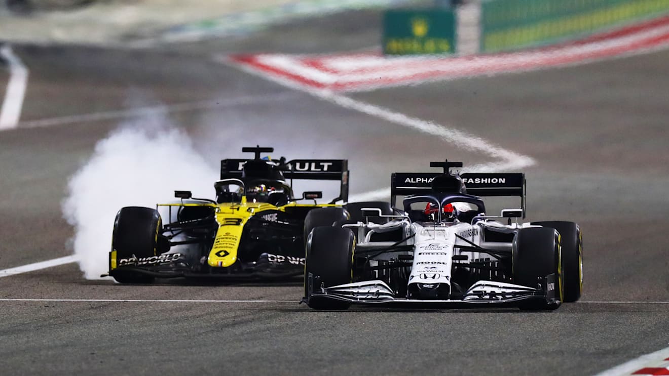 BAHRAIN, BAHRAIN - DECEMBER 06: Daniil Kvyat of Russia driving the (26) Scuderia AlphaTauri AT01 Honda and Daniel Ricciardo of Australia driving the (3) Renault Sport Formula One Team RS20 battle for position during the F1 Grand Prix of Sakhir at Bahrain International Circuit on December 06, 2020 in Bahrain, Bahrain. (Photo by Dan Istitene - Formula 1/Formula 1 via Getty Images)
