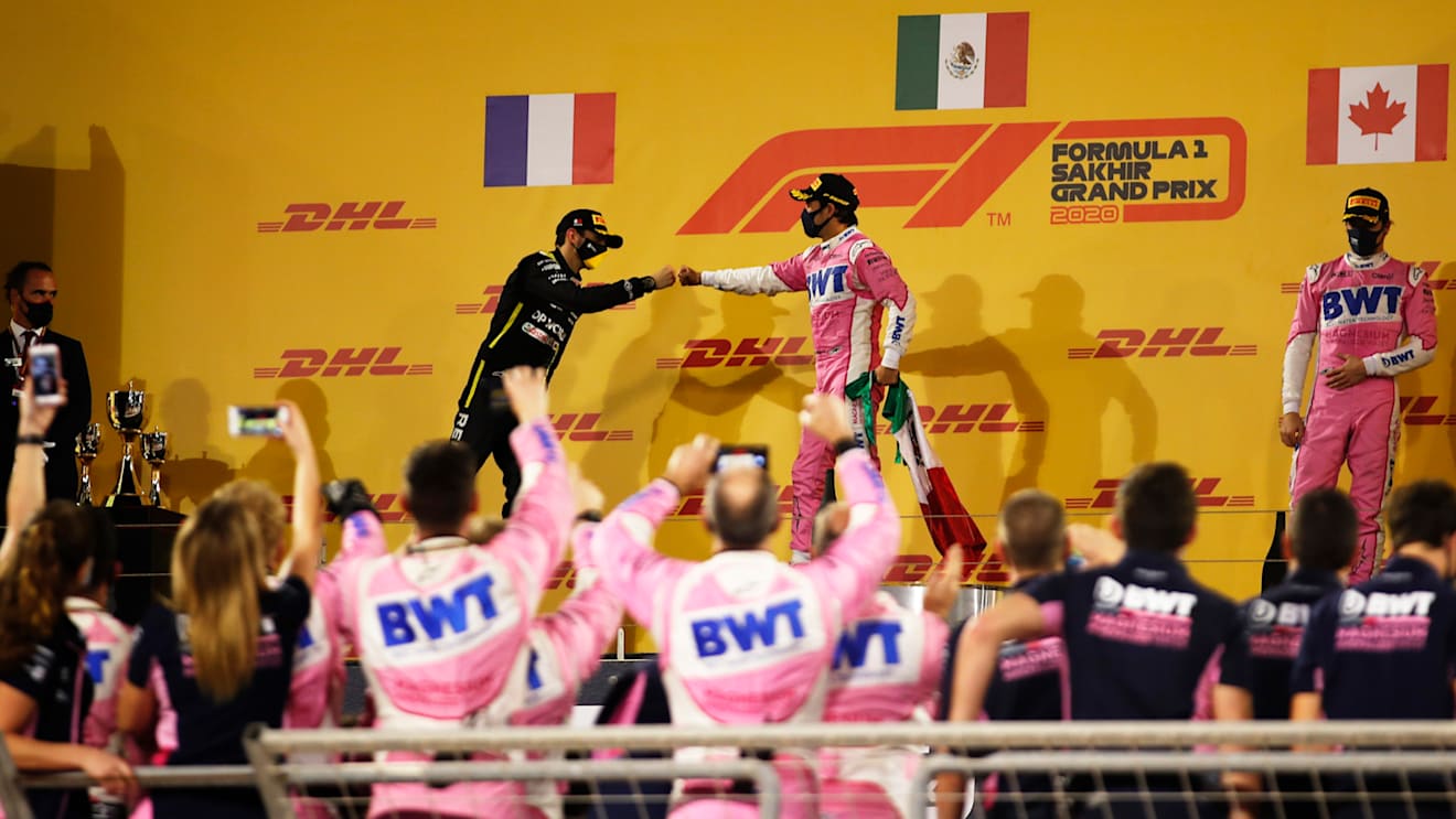 BAHRAIN, BAHRAIN - DECEMBER 06: Race winner Sergio Perez of Mexico and Racing Point and second placed Esteban Ocon of France and Renault Sport F1 celebrate on the podium during the F1 Grand Prix of Sakhir at Bahrain International Circuit on December 06, 2020 in Bahrain, Bahrain. (Photo by Hamad I Mohammed - Pool/Getty Images)